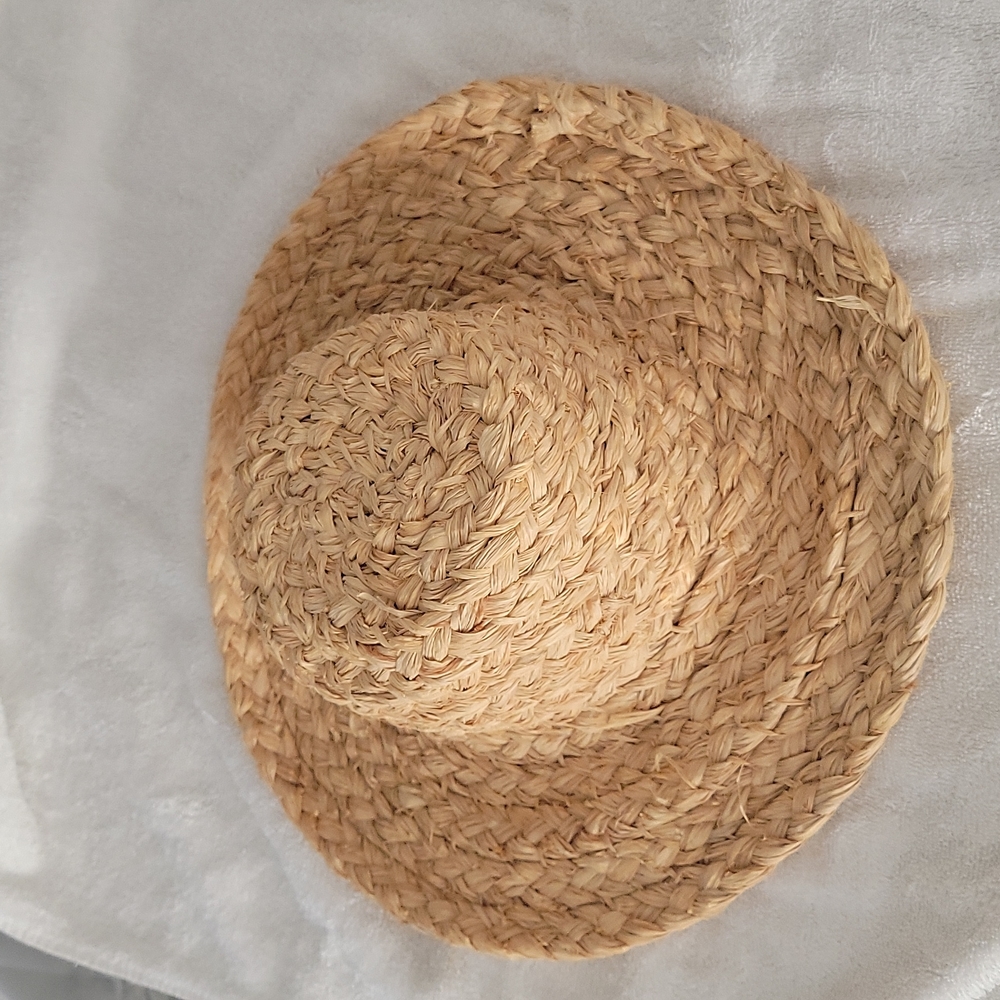 Handcrafted Gabrielle Gillies straw hat.